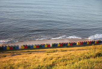 View of Beach Huts from the West Cliff.