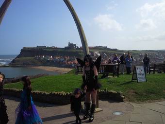 Photo of a Whitby Goth and children near the Whalebones