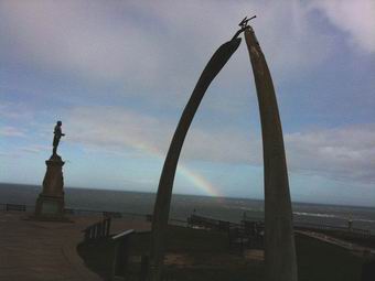 Rainbow near Captain Cook's Statue and the Whalebonesin Whitby Yorkshire 