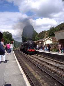 Steam train pulling into Goathland Station