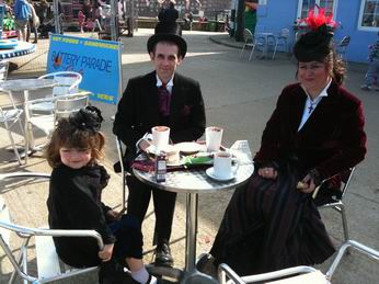 Photo of a Gothic family drinking tea