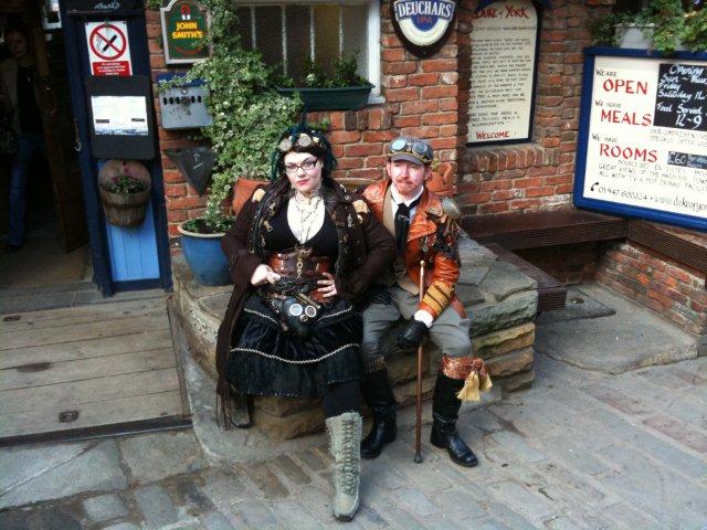 A steampunk couple outside the Duke of York
