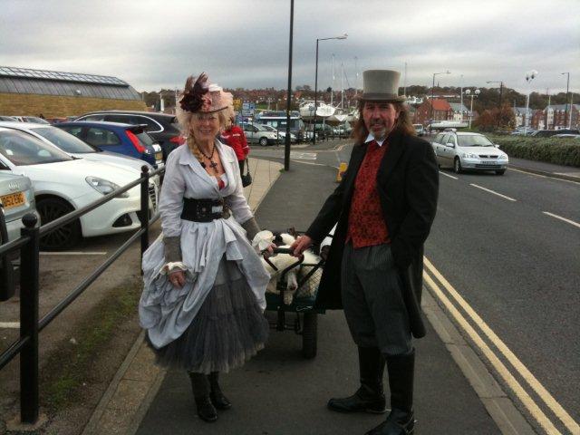 Photo o f Gothic couple and the large white dog Oliver