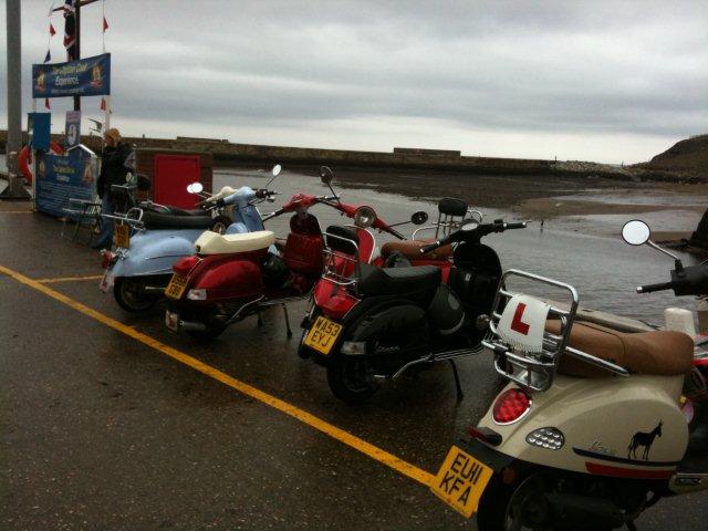 Photo of some scooters by the harbourside in Whitby