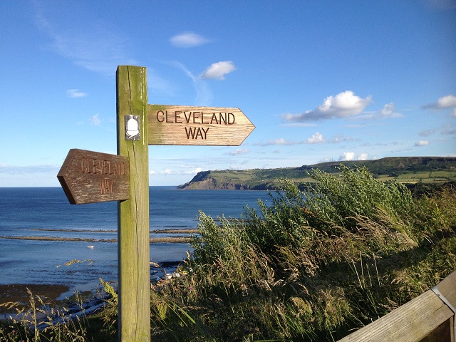 A photo of Robin Hood's Bay with Ravenscar in the background