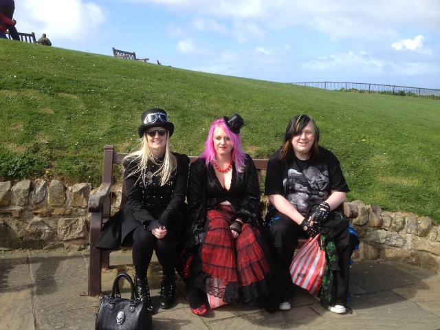 Photo of three Goths taking in the view