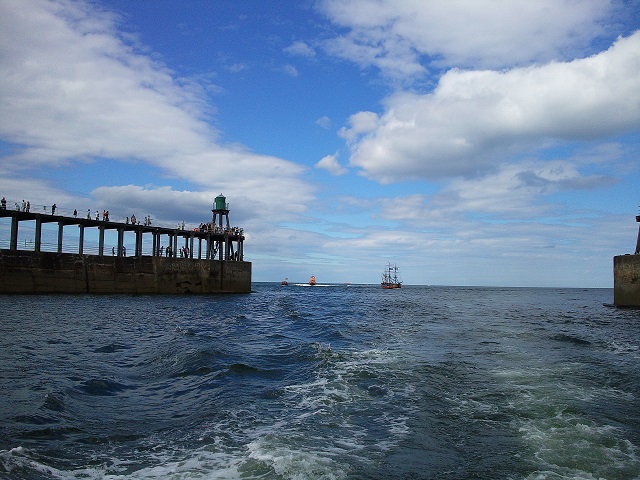 Photo of Whitby Harbour with blue skies