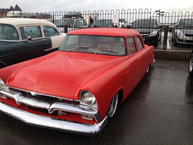 Photo of a red car with a skeleton passenger